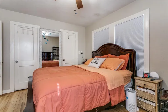 a view of a backyard with table and chairs under an umbrella