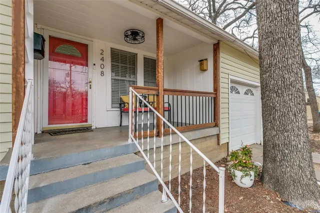 a living room with furniture a flat screen tv and a window