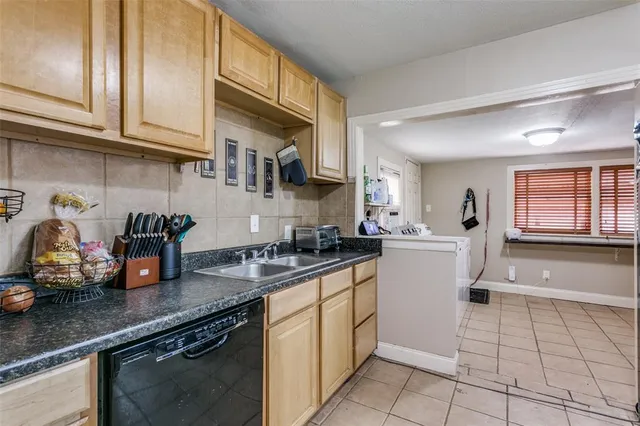 a kitchen with stainless steel appliances granite countertop a stove and a refrigerator
