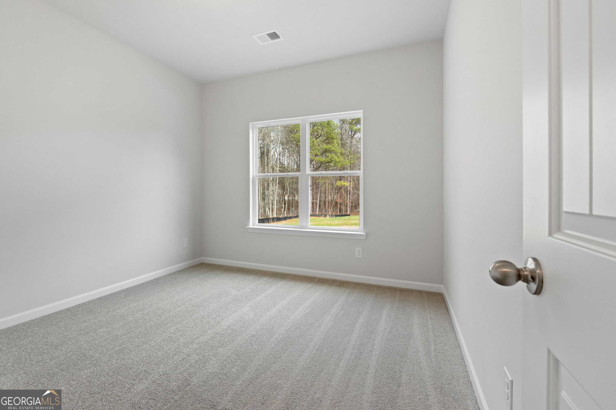 25 Patterson Drive Franklin, GA 30217 - Photo 32 of 36 a view of an empty room with a window
