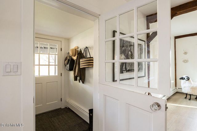 a kitchen with stainless steel appliances a refrigerator and cabinets