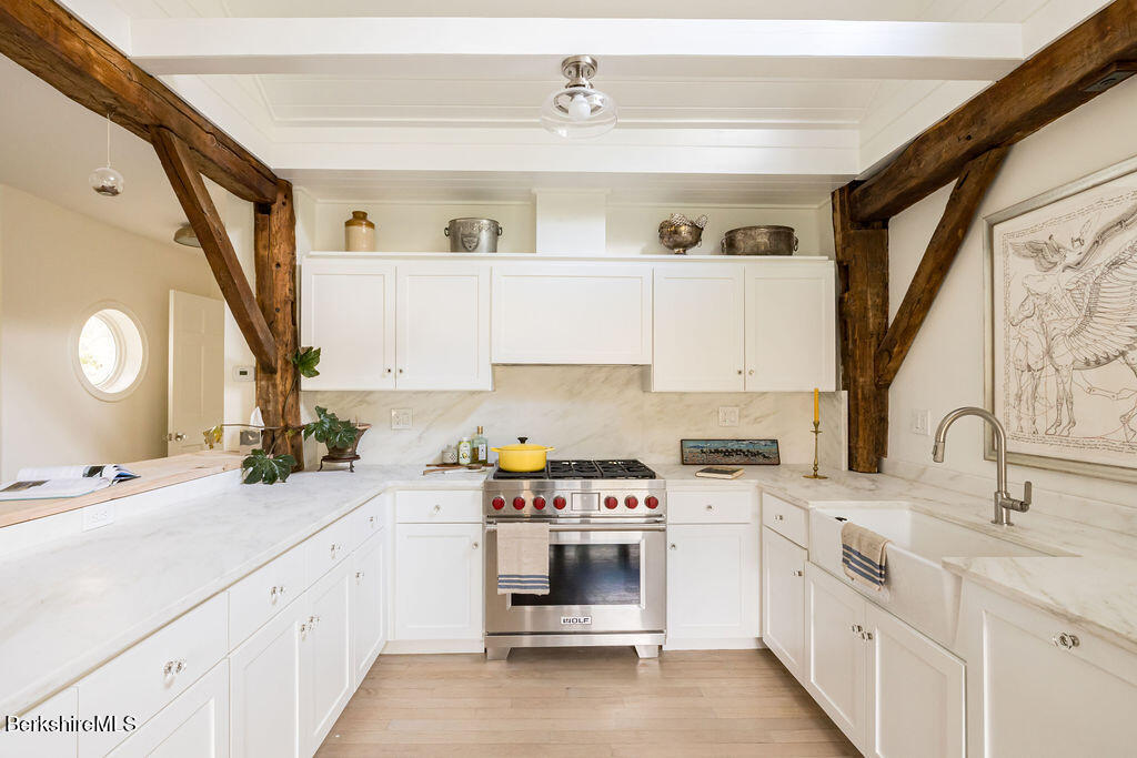 302 A Egremont Plain Road Egremont, MA 01230 - Photo 16 of 66 a kitchen with a sink cabinets and appliances