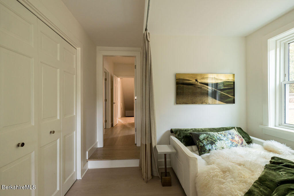 302 A Egremont Plain Road Egremont, MA 01230 - Photo 38 of 66 a living room with a couch and a dresser next to a window