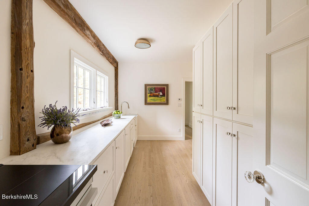 302 A Egremont Plain Road Egremont, MA 01230 - Photo 44 of 71 a spacious bathroom with a double vanity and a large mirror