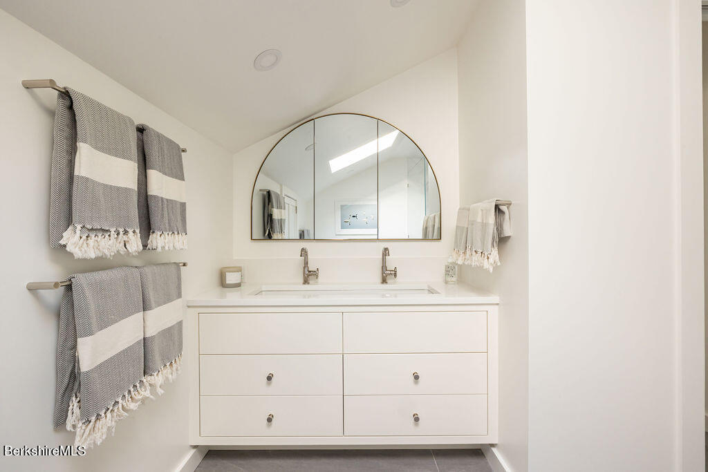 302 A Egremont Plain Road Egremont, MA 01230 - Photo 51 of 66 a bathroom with a double vanity sink and mirror