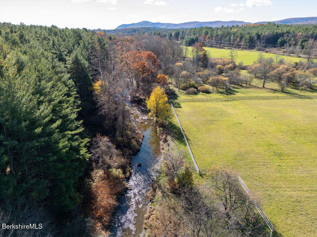 302 A Egremont Plain Road Egremont, MA 01230 - Photo 7 of 66 a view of a lake with a yard and mountain view