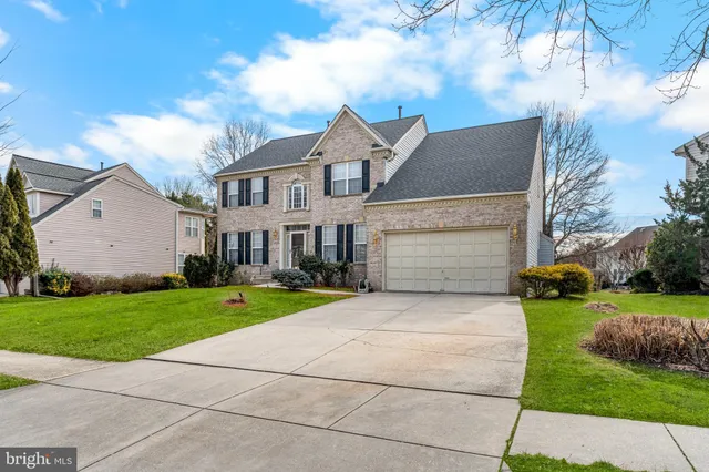 a view of a room with a sink and a chandelier fan