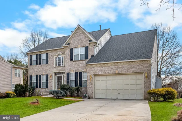 wooden floor in an empty room with a fireplace