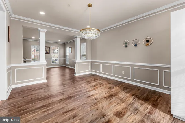 a large kitchen with stainless steel appliances granite countertop a stove a sink and a refrigerator