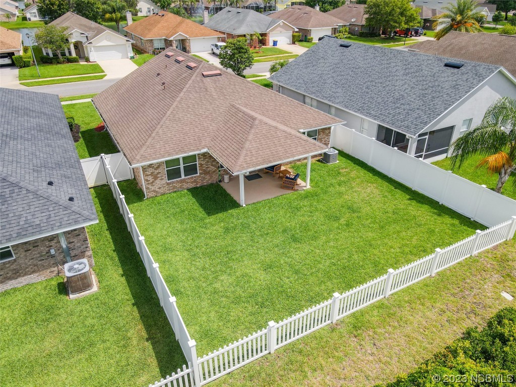 512 Coral Trace Boulevard Edgewater, FL 32132 - Photo 2 of 45 an aerial view of residential houses with outdoor space and trees
