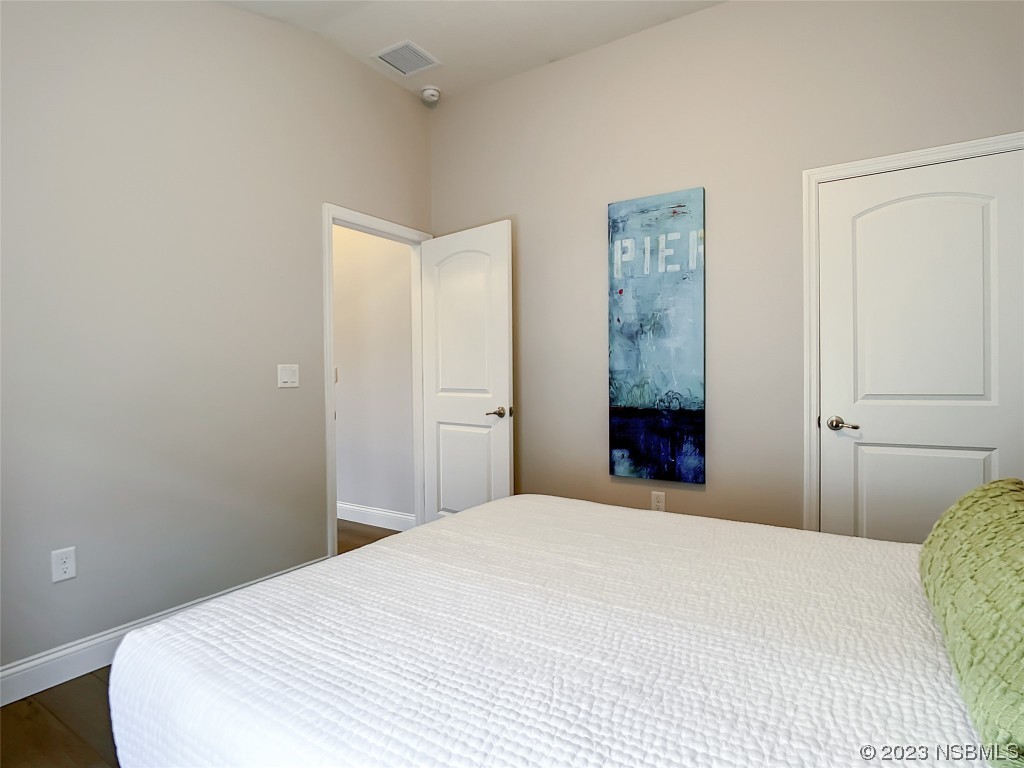 512 Coral Trace Boulevard Edgewater, FL 32132 - Photo 27 of 45 a bedroom with a bed and a window