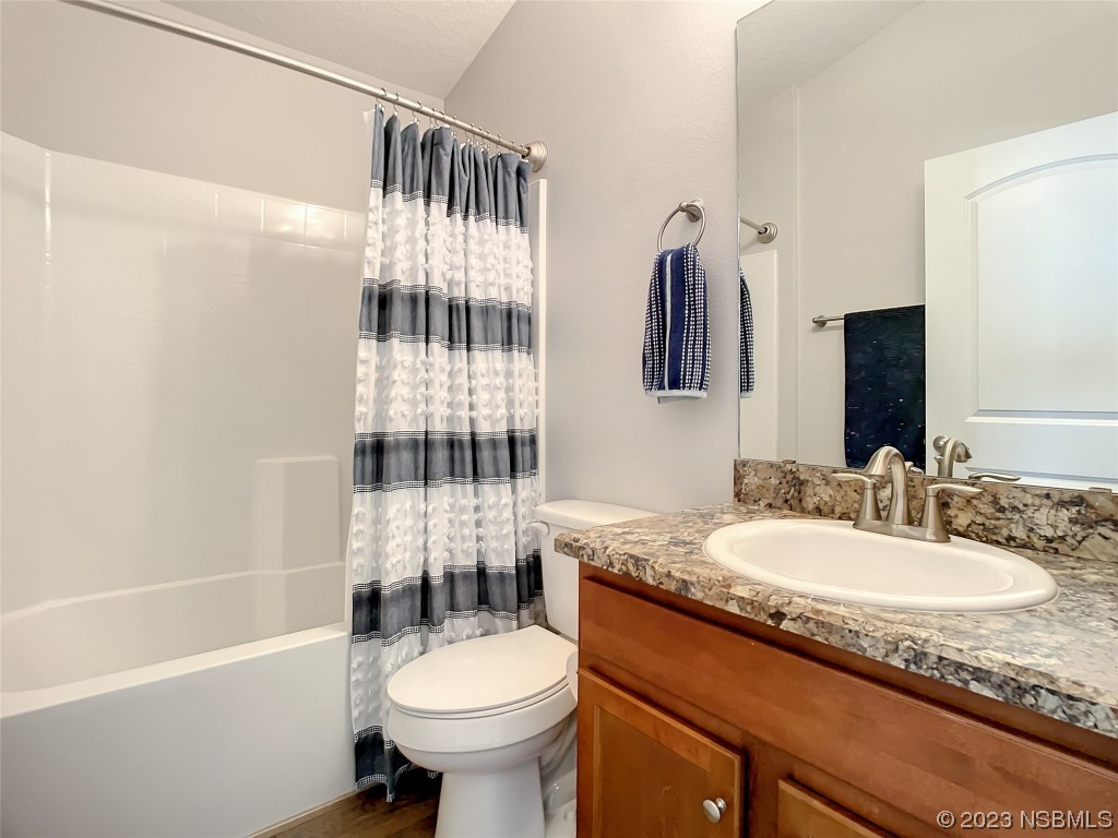 512 Coral Trace Boulevard Edgewater, FL 32132 - Photo 28 of 45 a bathroom with a sink toilet and shower