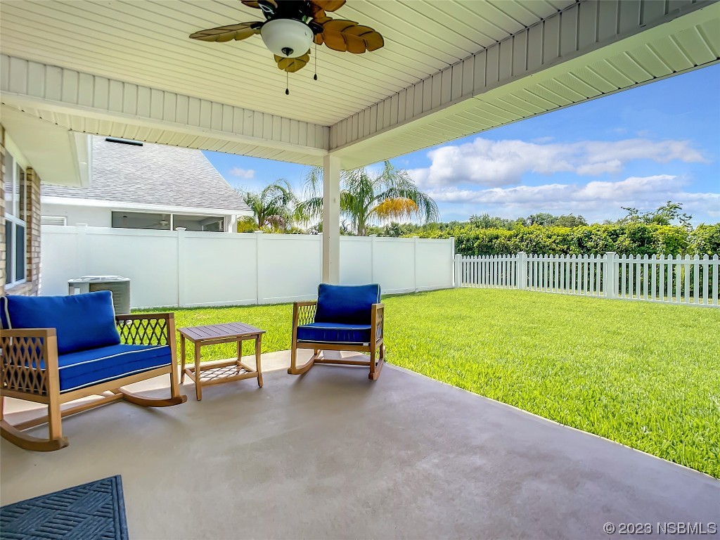 512 Coral Trace Boulevard Edgewater, FL 32132 - Photo 30 of 45 a balcony with furniture and a garden
