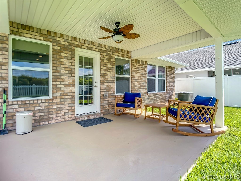 512 Coral Trace Boulevard Edgewater, FL 32132 - Photo 31 of 45 a bedroom with furniture and a large window