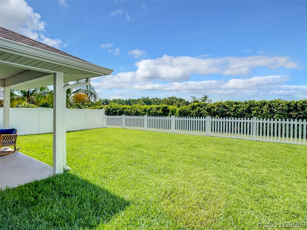512 Coral Trace Boulevard Edgewater, FL 32132 - Photo 32 of 45 a view of a garden
