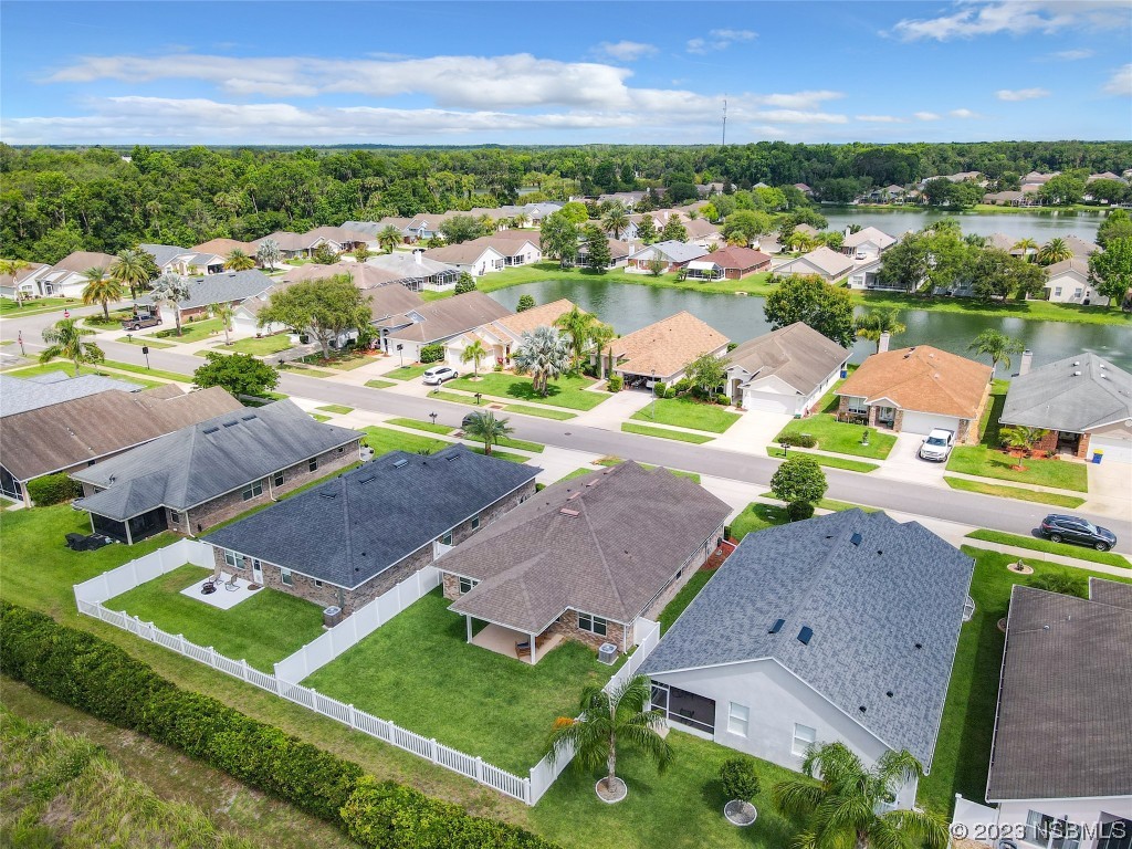 512 Coral Trace Boulevard Edgewater, FL 32132 - Photo 36 of 45 an aerial view of residential houses with outdoor space and street view