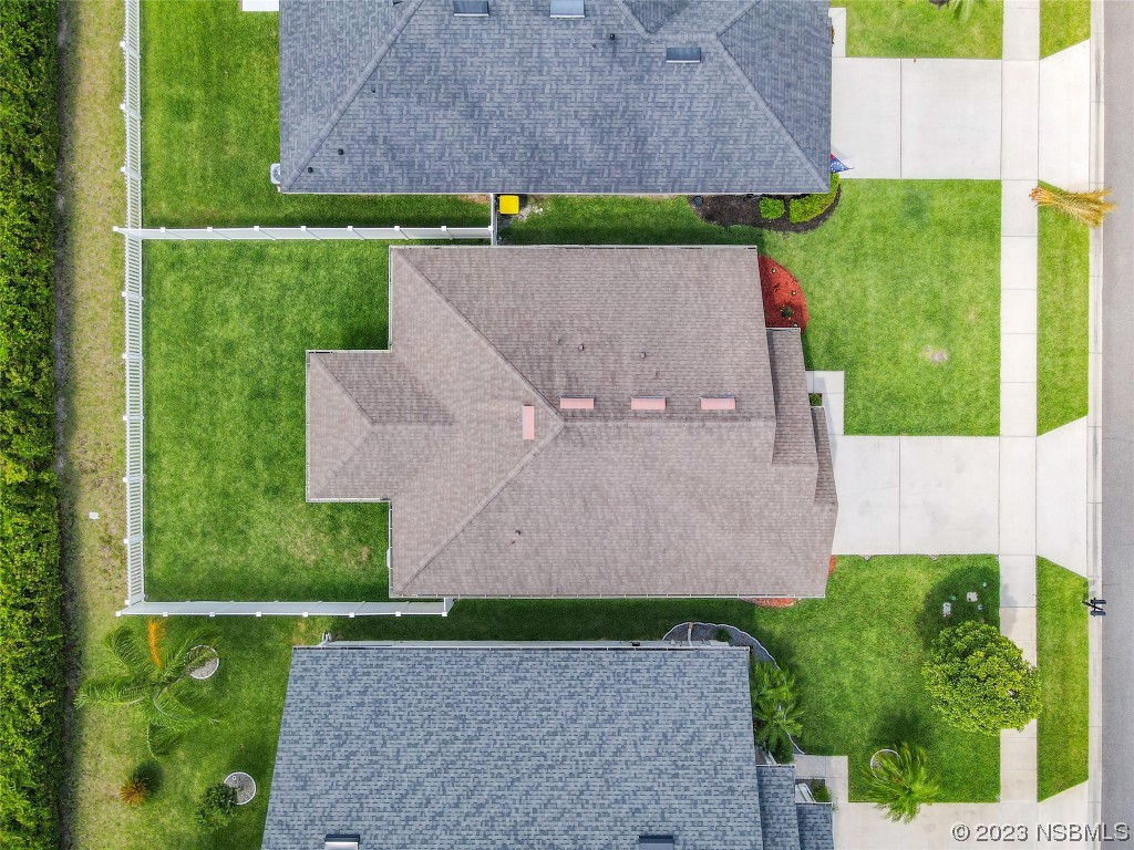 512 Coral Trace Boulevard Edgewater, FL 32132 - Photo 39 of 45 an aerial view of a house with a garden
