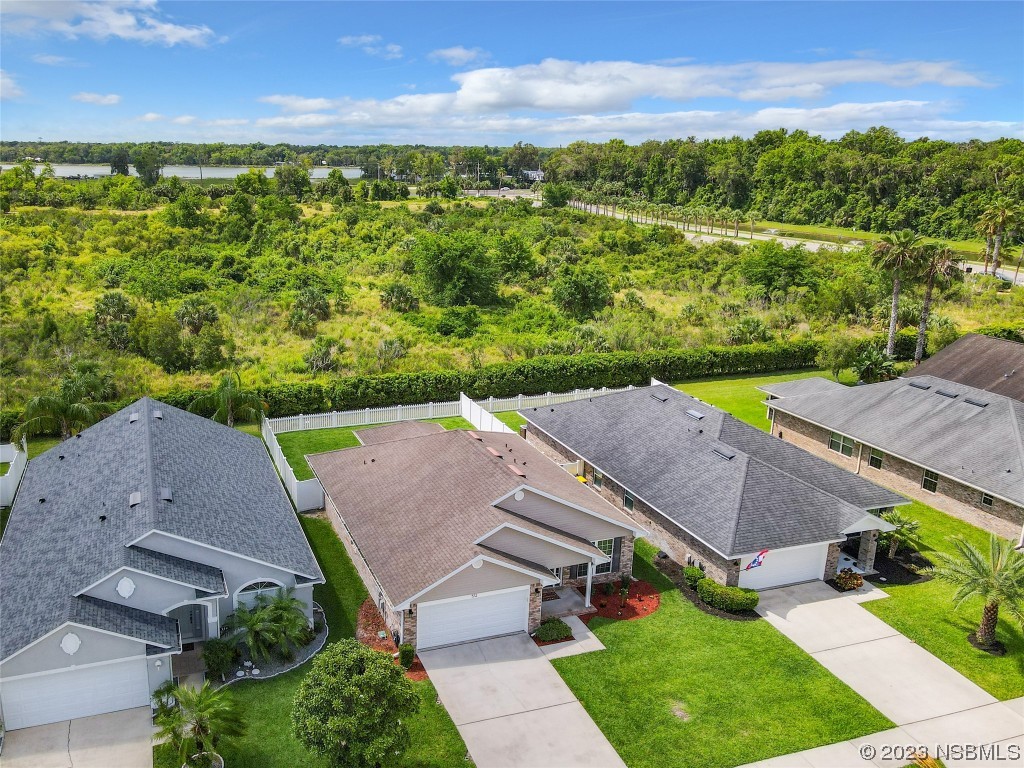 512 Coral Trace Boulevard Edgewater, FL 32132 - Photo 40 of 45 an aerial view of a house with garden space and outdoor space