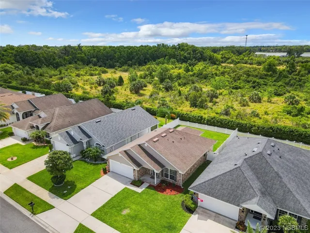 an aerial view of a house with a garden