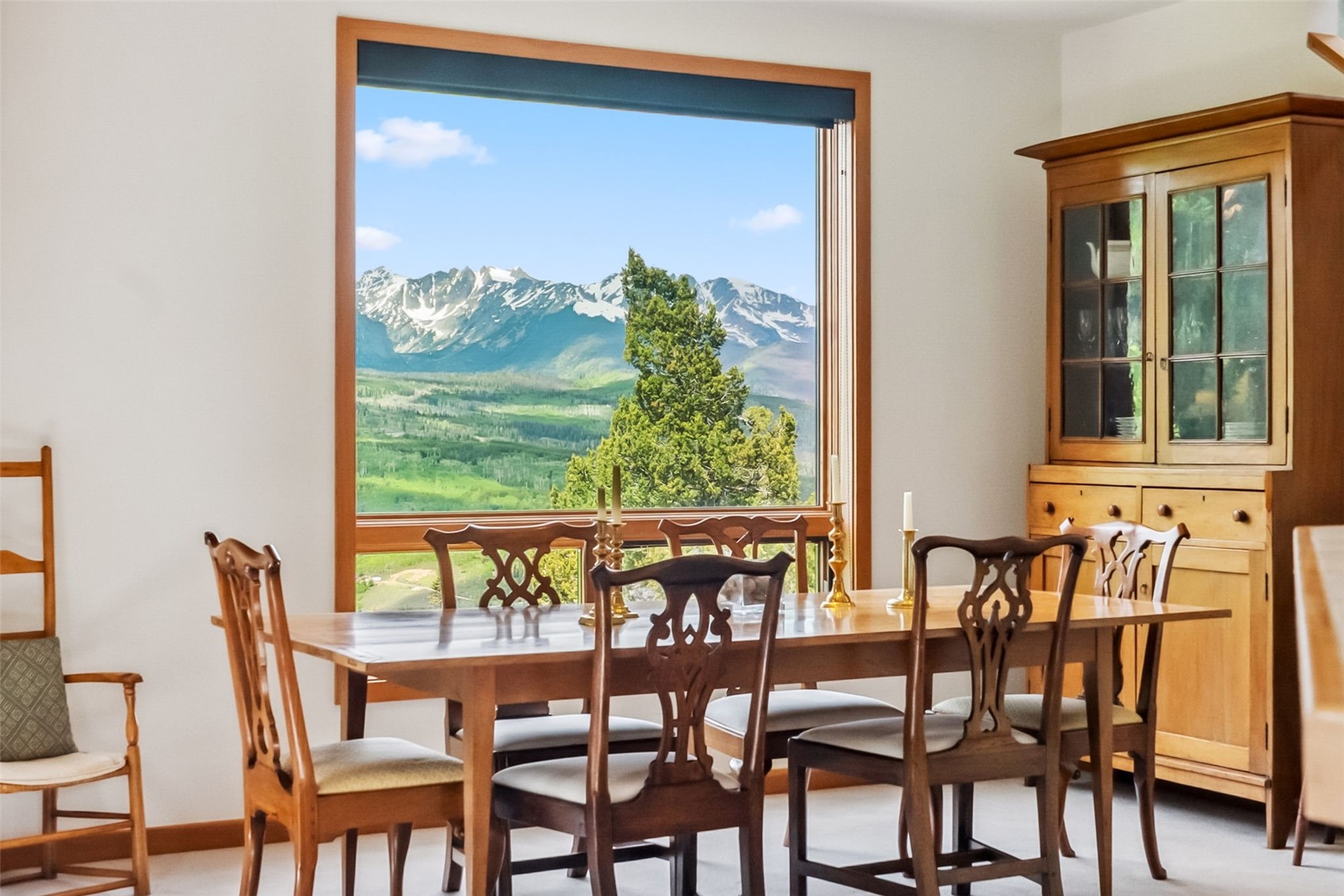 212 Spruce Ridge Road Silverthorne, CO 80498 - Photo 16 of 50 Dining room with plenty of natural light, a mountain view, and baseboards