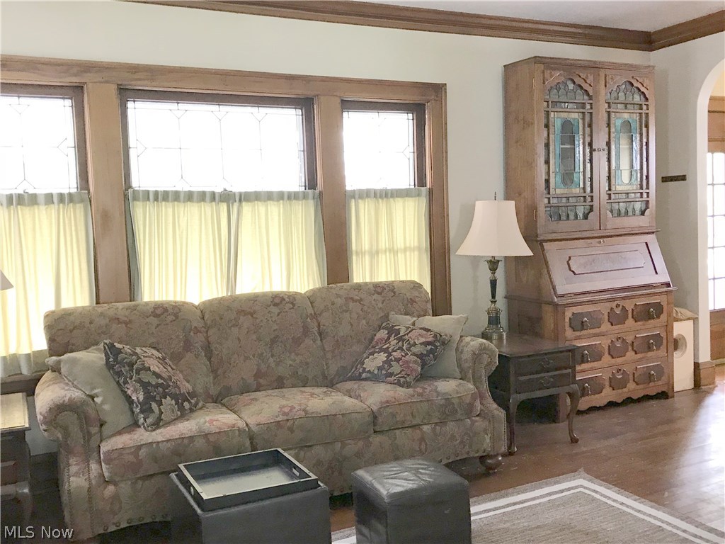 1029 Woodview Road Cleveland, OH 44121 - Photo 3 of 35 Living Room picture windows are leaded glass preserved!