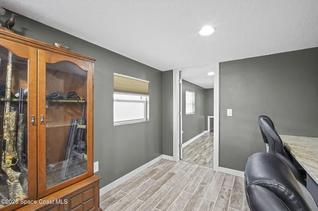 a bedroom with furniture and a window