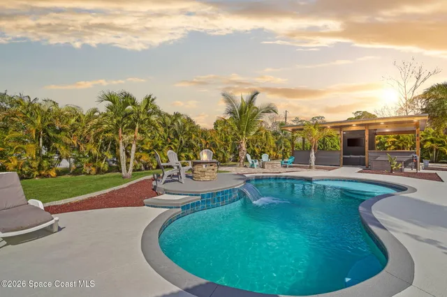 a view of a swimming pool with a patio