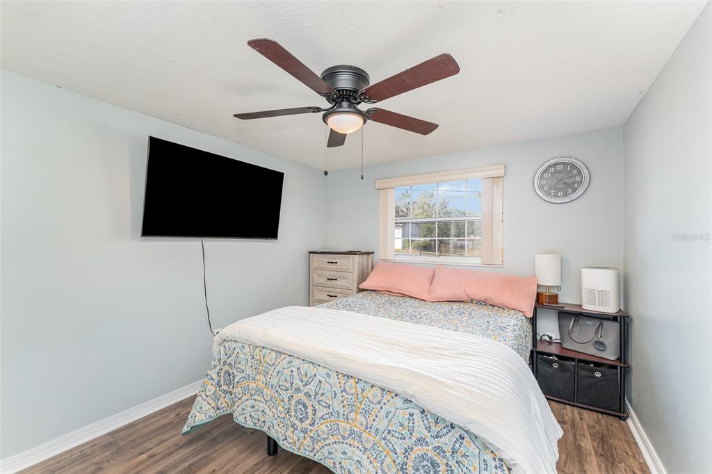 4145 Willow Oak Road Mulberry, FL 33860 - Photo 12 of 30 a bedroom with a bed and a flat screen tv