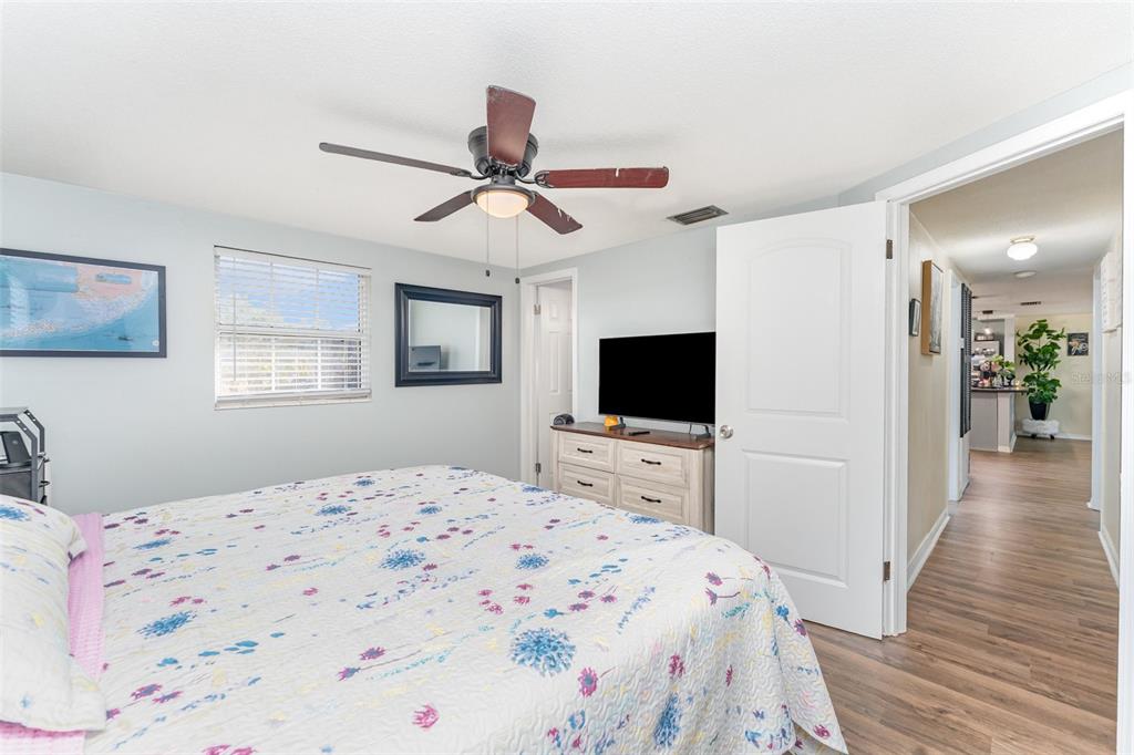 4145 Willow Oak Road Mulberry, FL 33860 - Photo 17 of 30 a bedroom with a bed and a flat screen tv