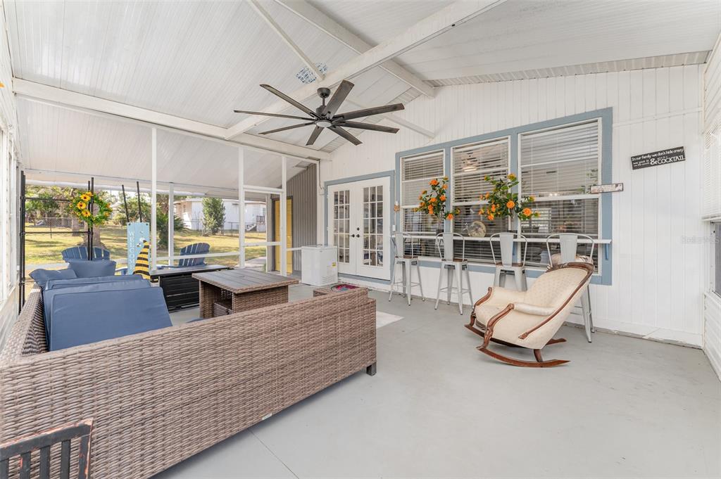 4145 Willow Oak Road Mulberry, FL 33860 - Photo 24 of 30 a living room with furniture gym equipment and large windows