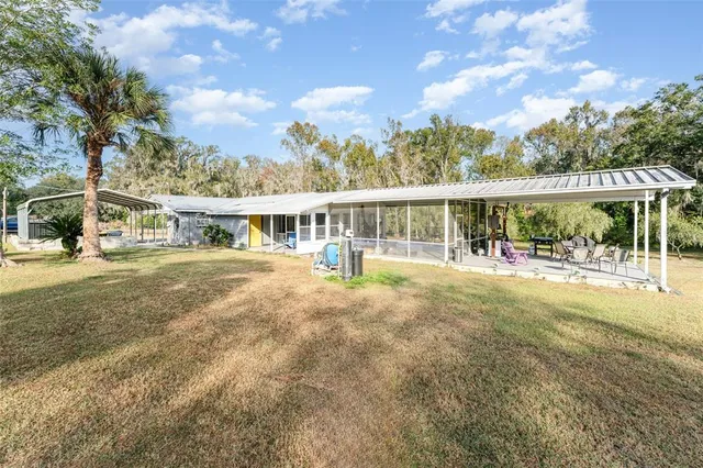 a view of house with yard
