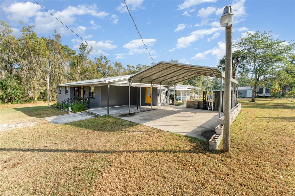 4145 Willow Oak Road Mulberry, FL 33860 - Photo 3 of 30 a view of a house with backyard and tree