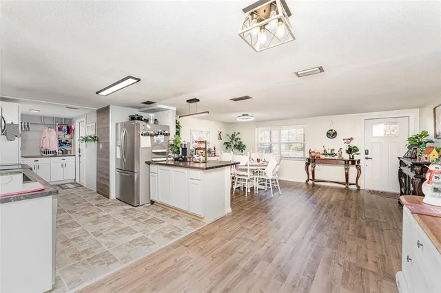 a view of a kitchen and dining room