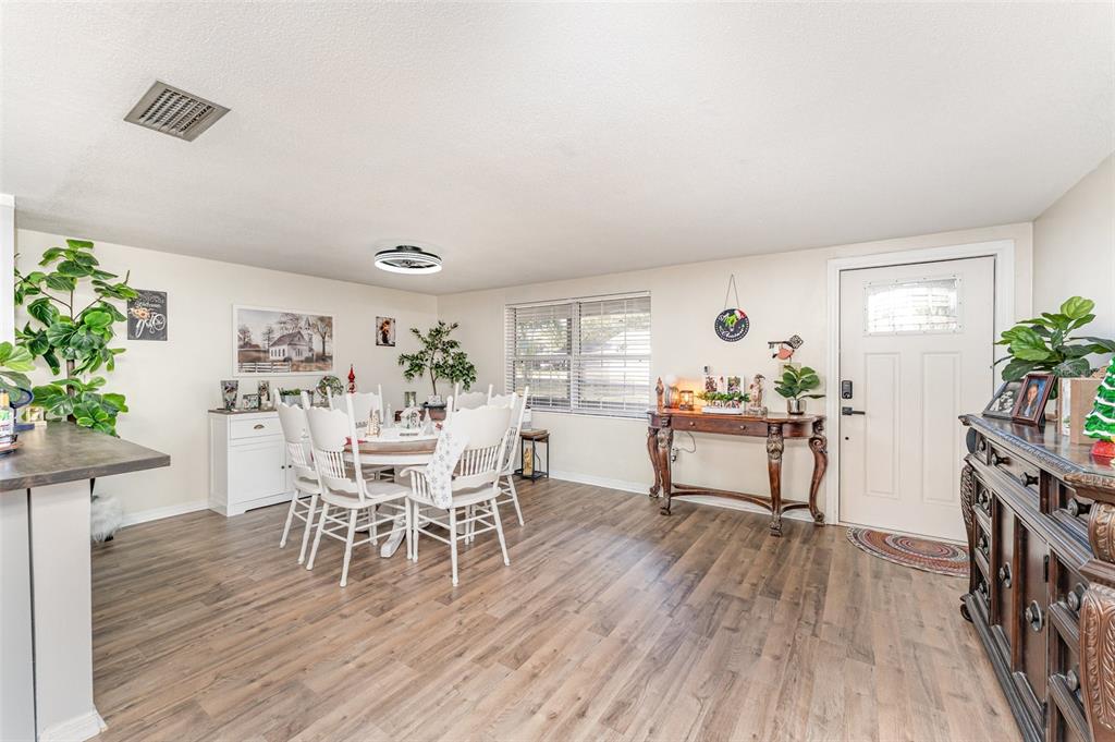 4145 Willow Oak Road Mulberry, FL 33860 - Photo 6 of 30 a dining room with furniture and wooden floor
