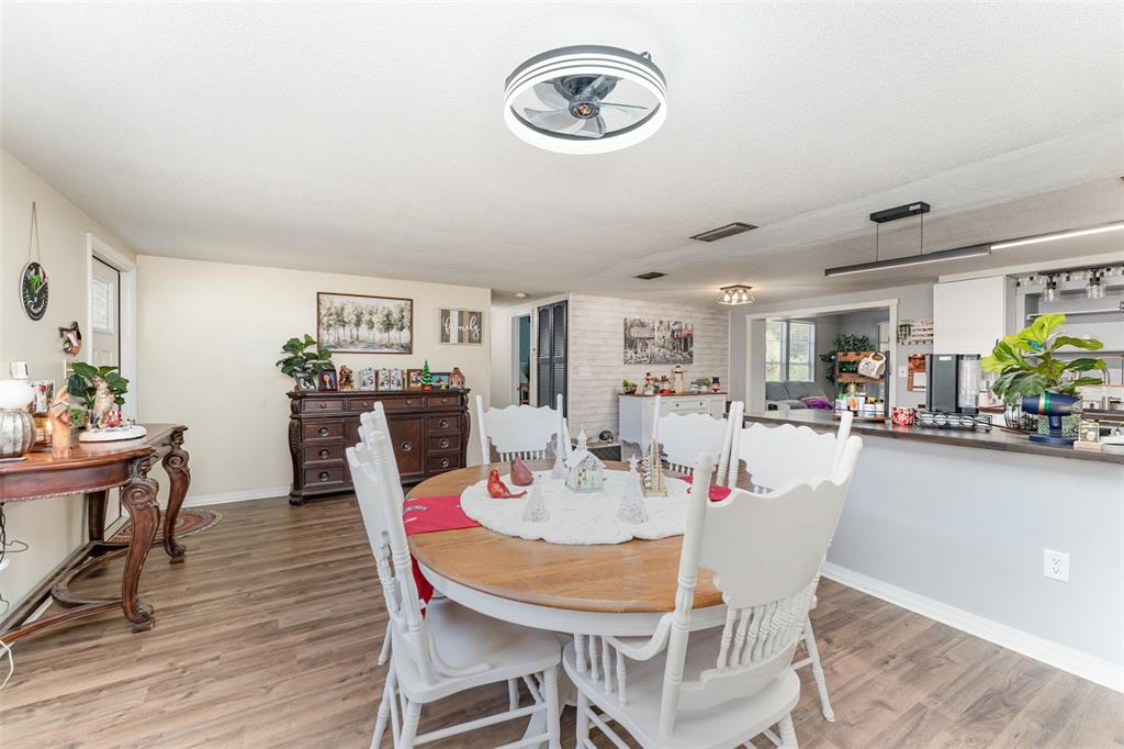 4145 Willow Oak Road Mulberry, FL 33860 - Photo 7 of 30 a dining room with furniture and wooden floor