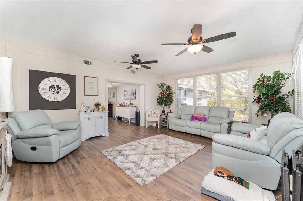 4145 Willow Oak Road Mulberry, FL 33860 - Photo 9 of 30 a living room with furniture and a wooden floor