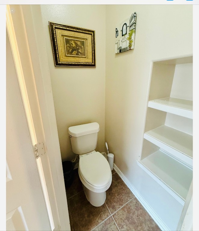 3114 Double Jack Court Spring, TX 77373 - Photo 18 of 41 a white toilet sitting next to a white cabinet