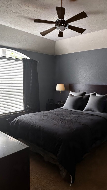 3114 Double Jack Court Spring, TX 77373 - Photo 27 of 41 a bedroom with a bed and a chandelier