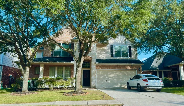 a view of a town with large trees