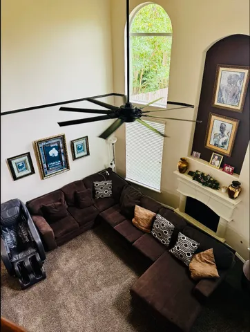 a living room with furniture and a window