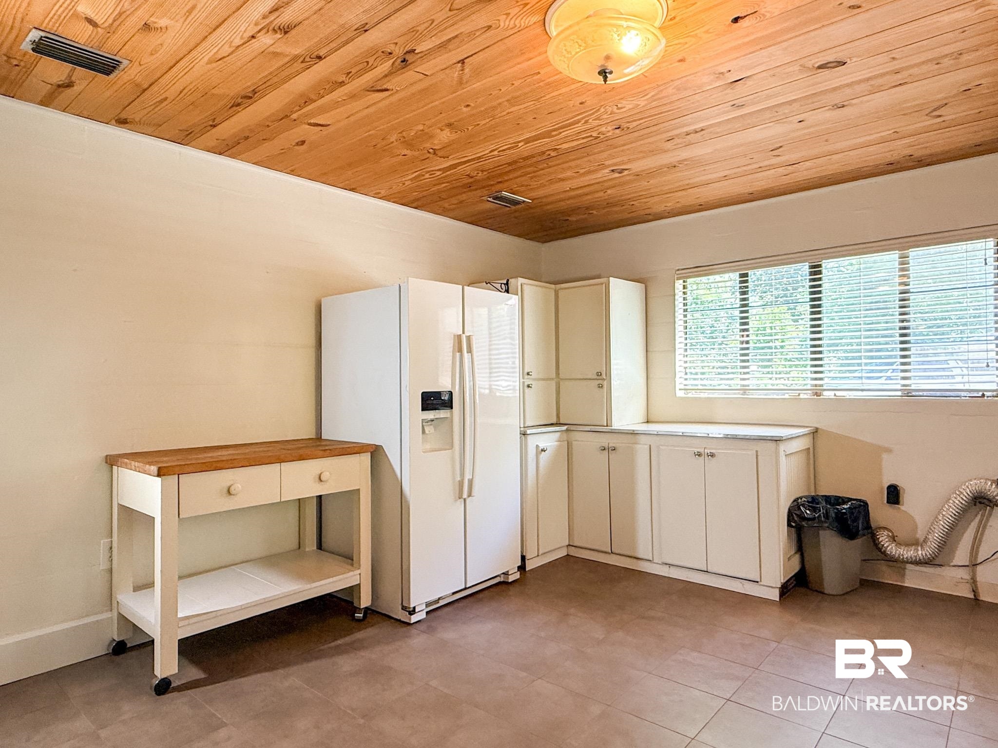 18711 Keller Road Foley, AL 36535 - Photo 13 of 38 Warm wood-paneled ceiling with an overhead light fixture