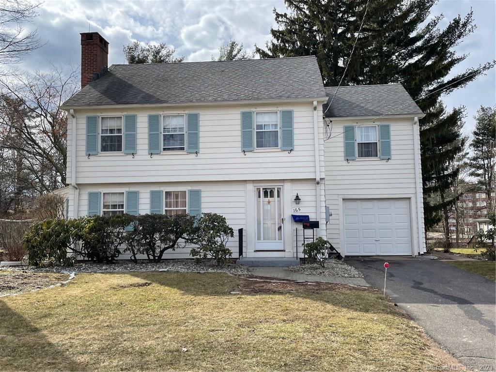 165 Ridge Road Wethersfield, CT 06109 - Photo 1 of 1 a front view of a house with garden