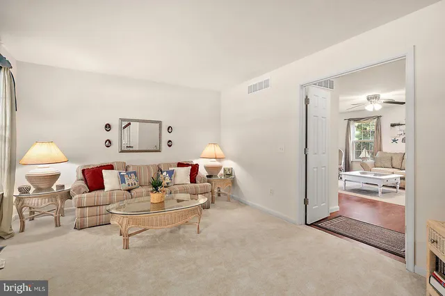 a living room with furniture and a table