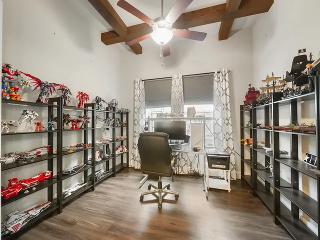 a view of a workspace with furniture