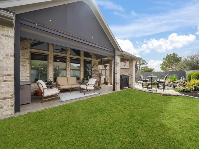 a living room with furniture and a garden