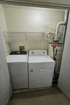 a utility room with dryer and washer