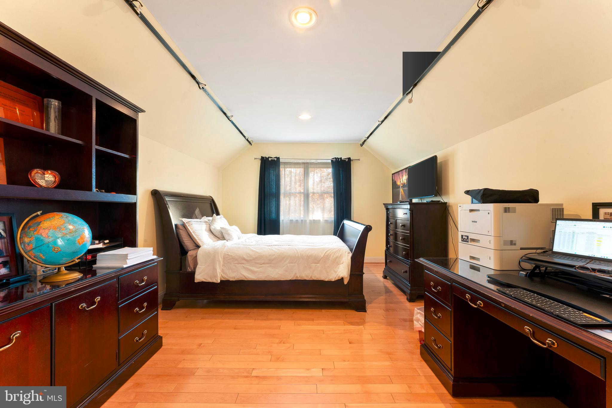 67 Lenape Road Richboro, PA 18954 - Photo 25 of 43 a spacious bedroom with a bed and flat screen tv