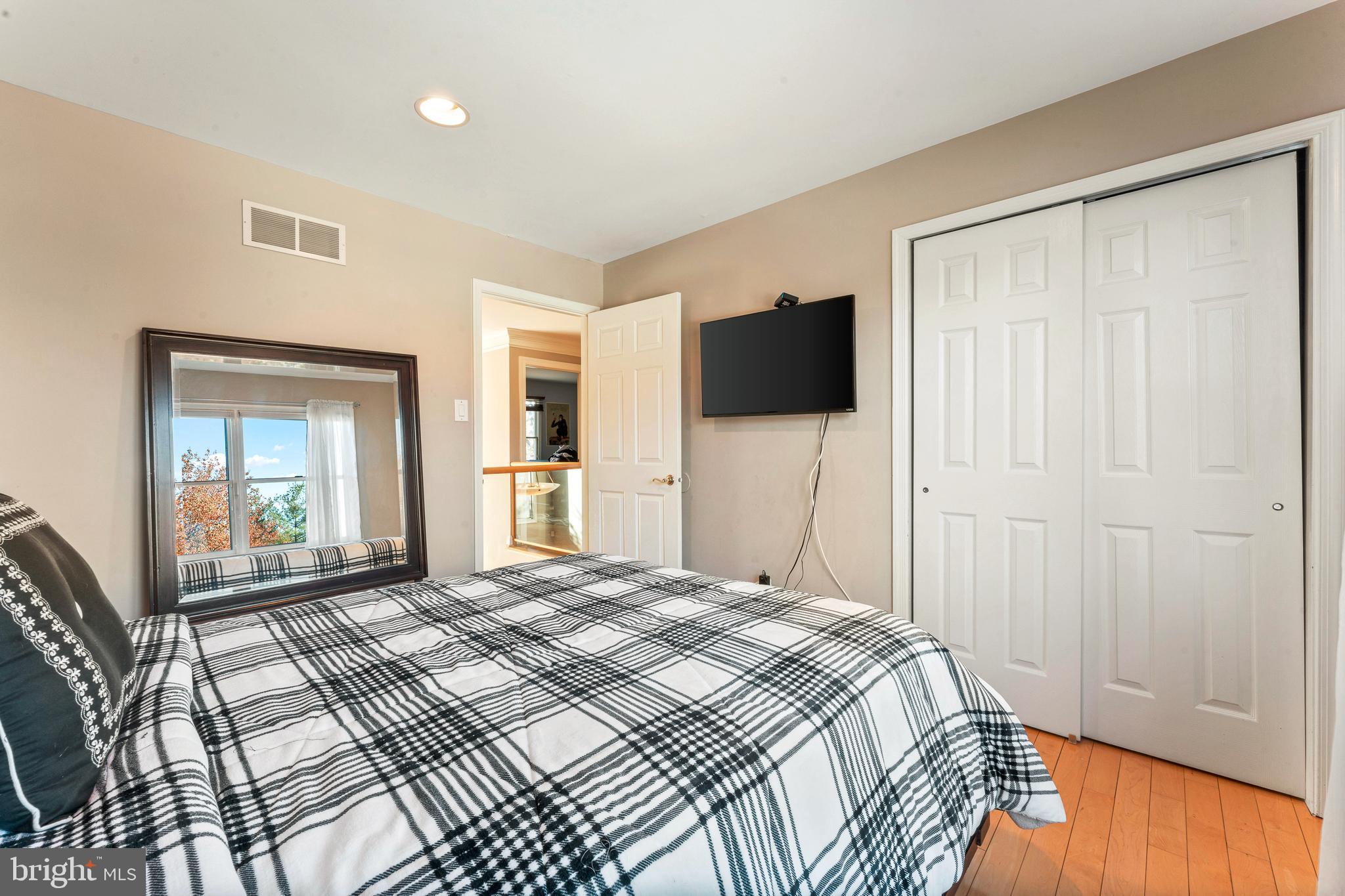 67 Lenape Road Richboro, PA 18954 - Photo 33 of 43 a bedroom with a bed and a flat screen tv