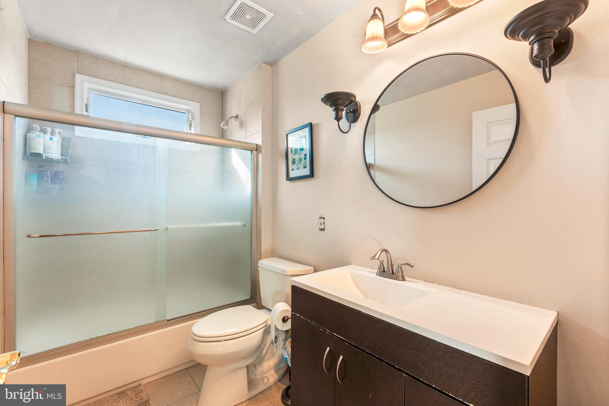 67 Lenape Road Richboro, PA 18954 - Photo 34 of 43 a bathroom with a sink a toilet and a mirror