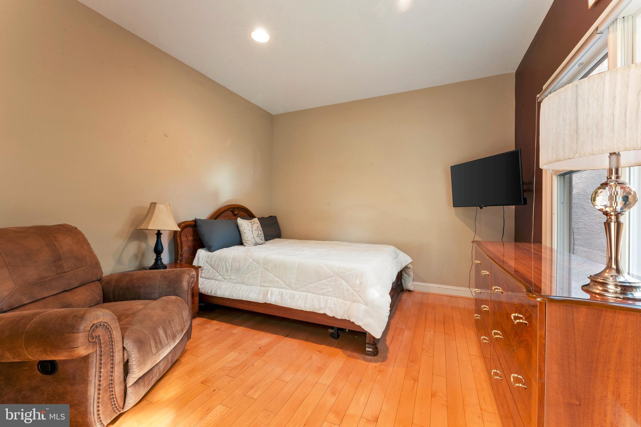 67 Lenape Road Richboro, PA 18954 - Photo 8 of 43 a bed room with a bed and a television